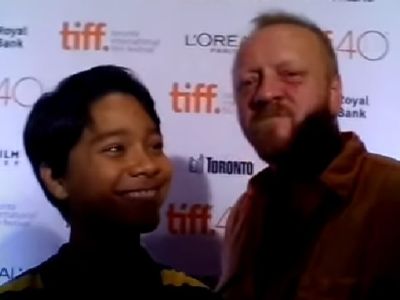 Filip Geljo is smiling whereas Jasmin Geljo is looking directly at the camera.